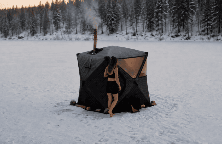 Sweat Tent portable wood-fired sauna in a snowy mountain landscape